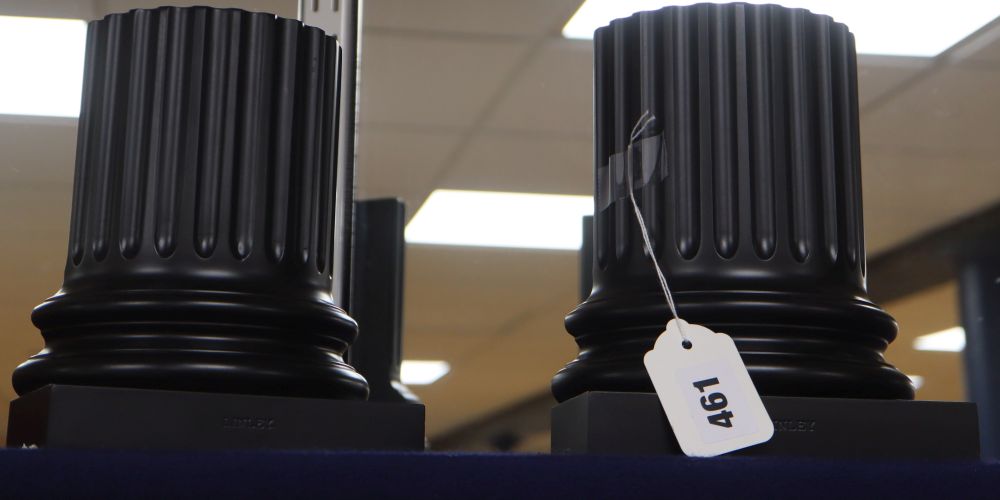 A pair of David Linley ebonised classical bookends